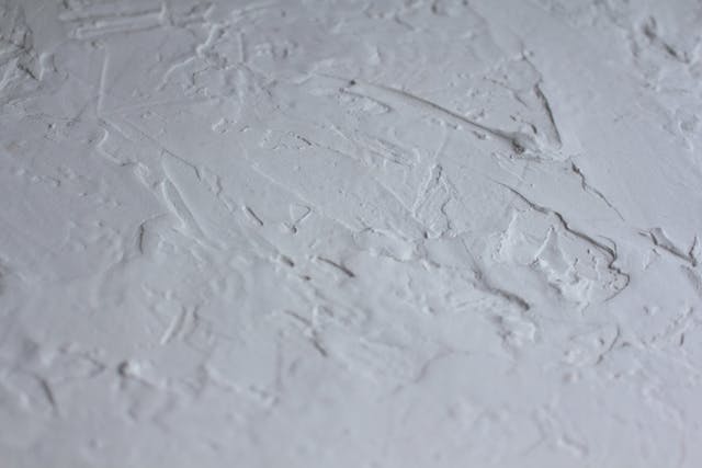 Textured plastering services work, rough finish for a unique and character-filled surface in home or business interiors. plaster a ceiling and wall job